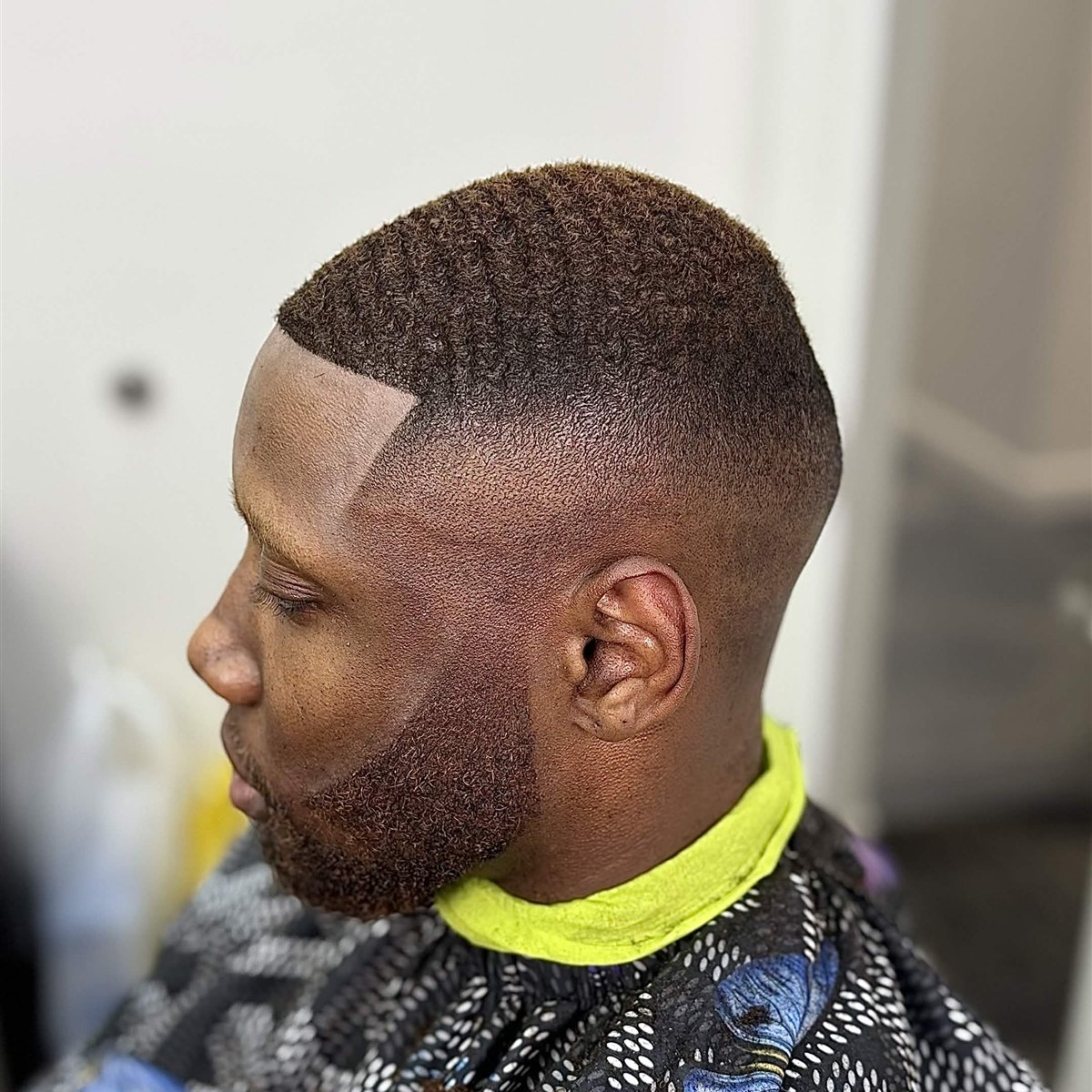 Skin fade with waves and a sharp part line-up, full beard, Die4Fadez Barbershop barber in National City