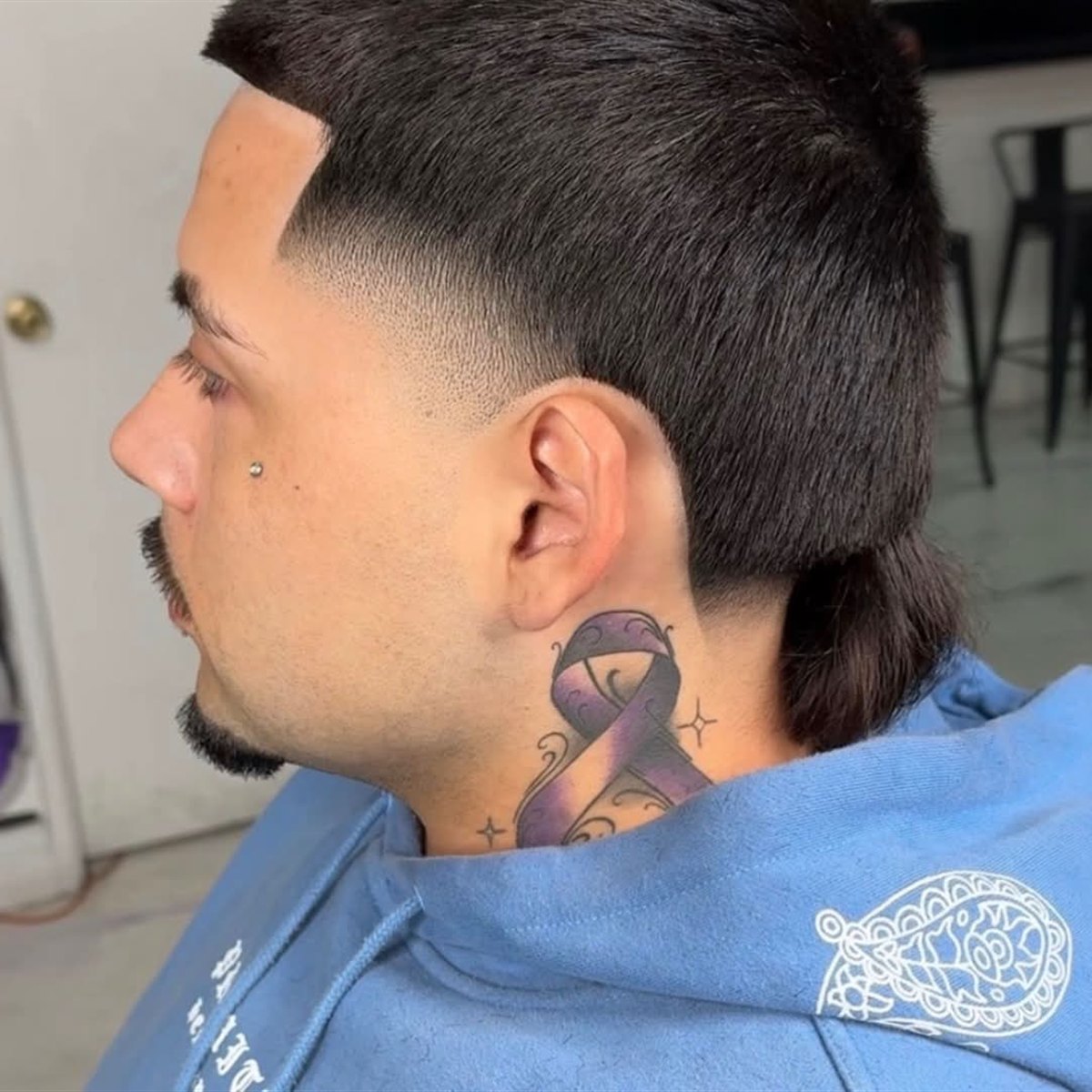 Mullet-style taper fade with a clean line-up, National City barber