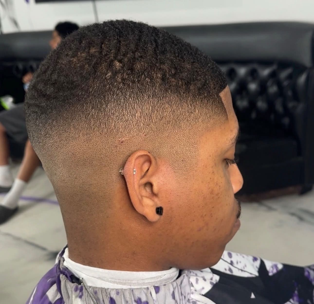 Low skin fade with natural waves on top, Die4Fadez Barbershop client in National City, CA