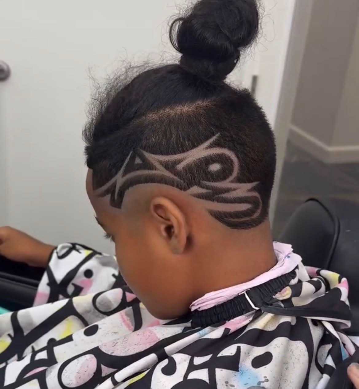 Shaved-side freestyle design with a top knot, Die4Fadez Barbershop client in National City, CA