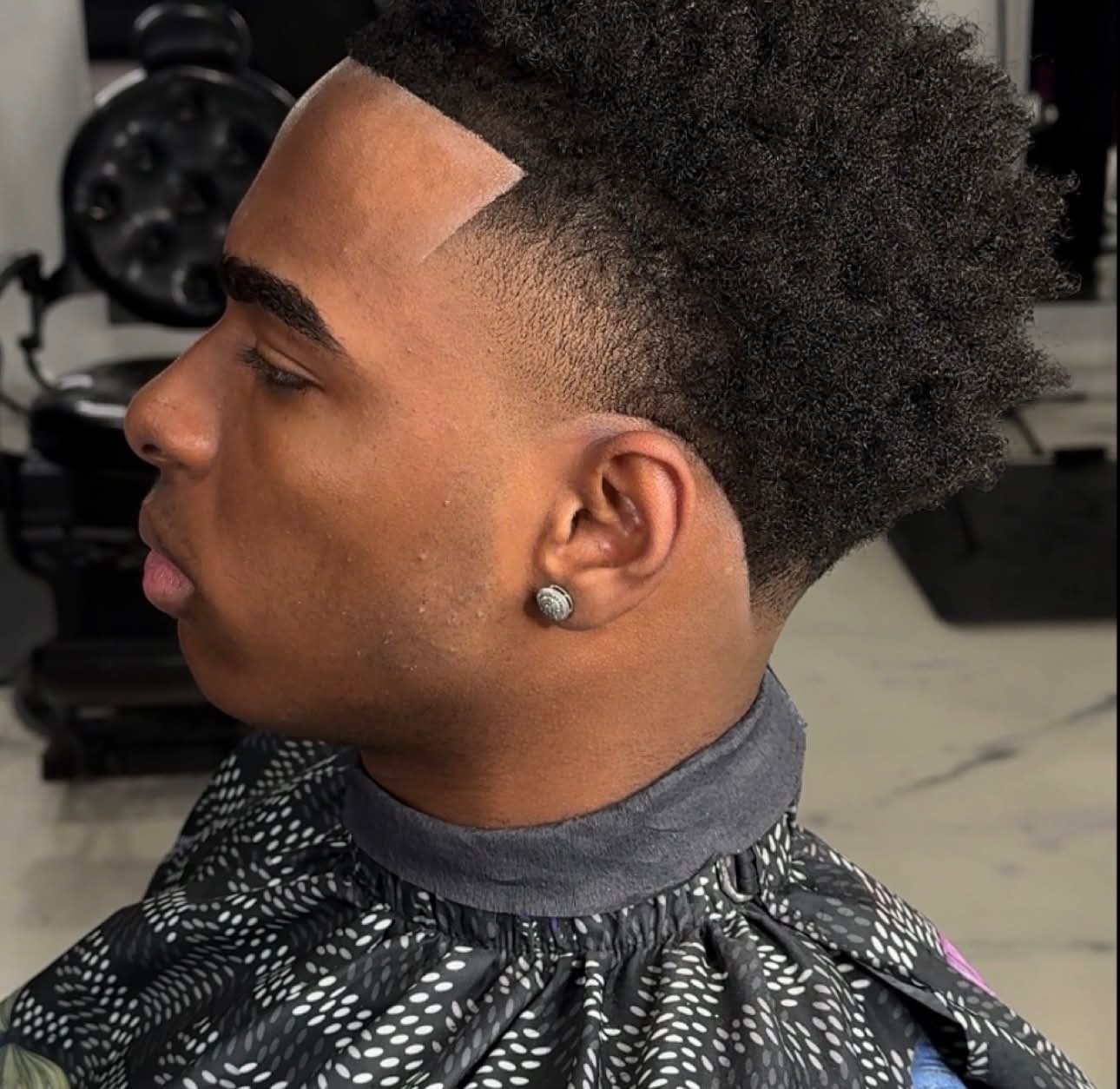 High-top curly fade with a sharp line-up, Die4Fadez Barbershop client in National City, CA